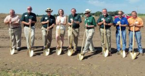 Precision Tank & Equipment Co. (PT&E) officials gathered for a groundbreaking ceremony on August 28, 2013 in Humboldt, IA.  Pictured from left to right are: Charlie Chemento, Brandt Co.; Mike Zeitler, PT&E VP of Operations; Ron Lager, PT&E National Sales Manager; Alissa Reinholdt, Humboldt County EDC Director; David Hemming, PT&E President & CEO; Glen Brandt, Founder of Brandt Co.; Gary Ruff, PT&E Regional Sales Manager; Walter Jensen, City of Humboldt Mayor; Joel Armitage, Sande Construction VP.